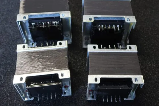 Group of four laminated E-I core transformers