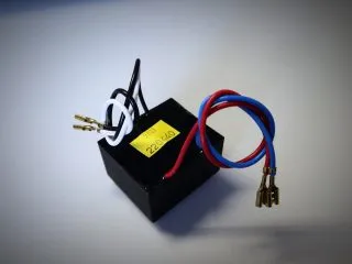 Laminated electrical transformer with insulated wires and spade connectors