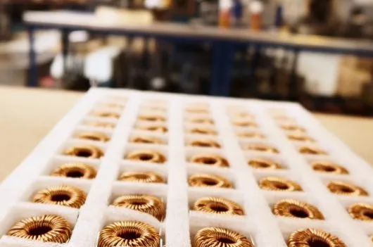 Copper-wound transformer components prepared for assembly in our UK manufacturing facility